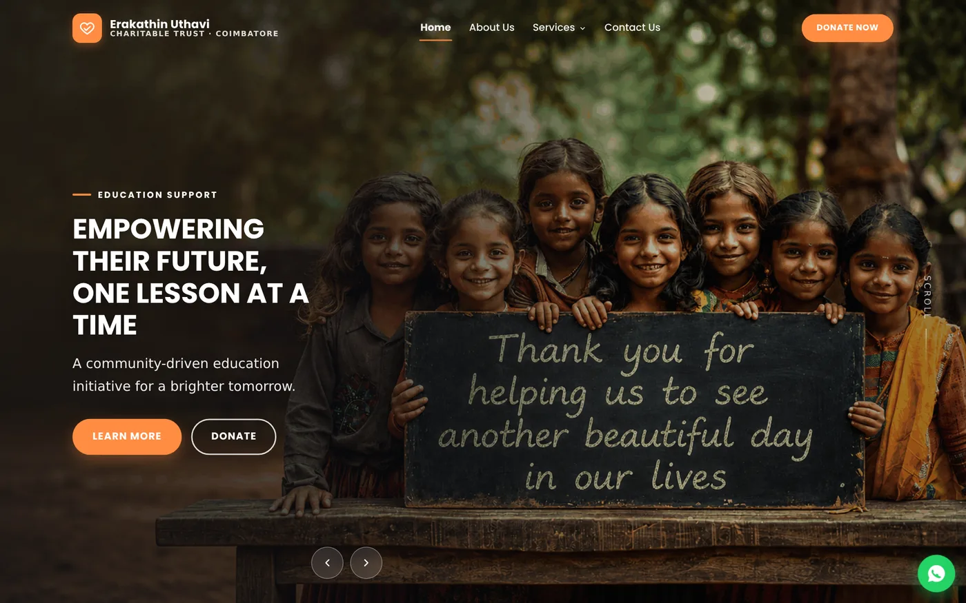 The Erakathin Uthavi homepage: a full-width photograph of schoolchildren holding a chalkboard, overlaid with the headline "Empowering their future, one lesson at a time", the trust's logo and navigation across the top, and a Donate Now button.